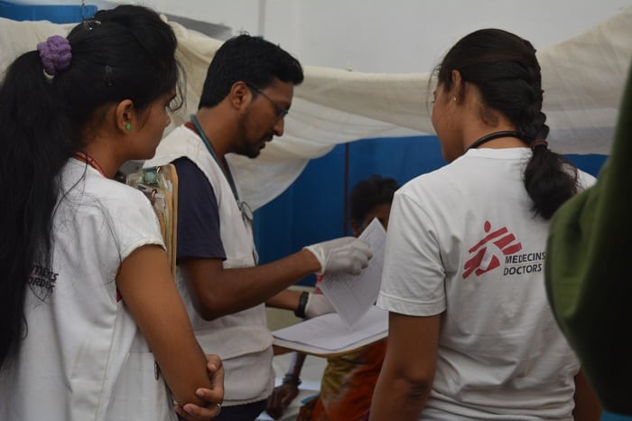 In one of their regular rounds of the In Patients Wards, MSF doctors Manoj Sarma (centre) and Sahithi (right) discuss a case of cellulitis of the foot. Photo: Parvati Tampi