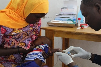 Eight-week-old Mohamed Zakari receives his first dose of the oral rotavirus vaccine (or the placebo). Photo: S&eacute;verine Bonnet/MSF