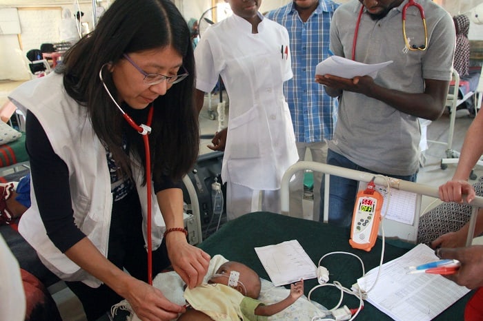 Dr Joanne Liu examines a baby during a visit to Maiduguri, Nigeria, February 2017. Photo: Malik Samuel/MSF