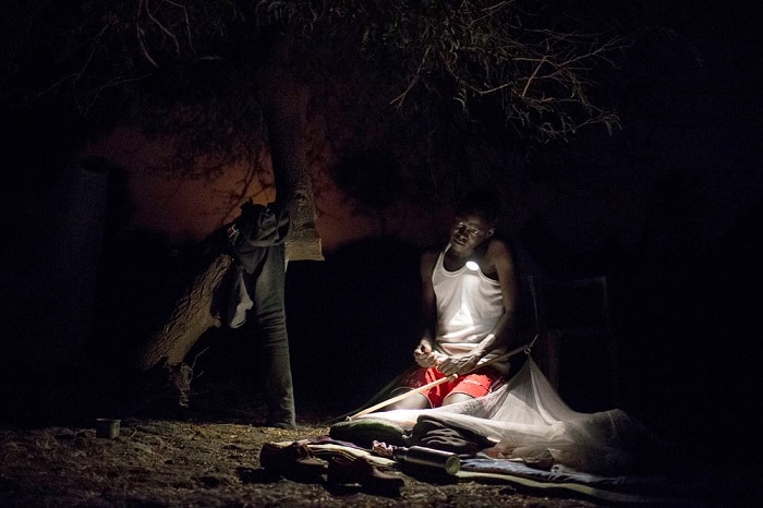 March 2017 &ndash; James, a Community Area Supervisor with MSF, organises his bedding for the night close to an MSF outdoor support clinic in Gier, Leer County, South Sudan.