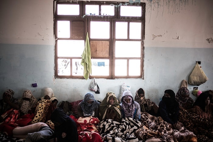 Crowded together with little more than a blanket and the clothes they wear, women detainees are held at the Sorman detention centre, some 60km west of Tripoli, Libya.