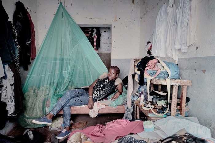 Debora Njala, 18, lies on her bed in Chiradzulu. Deborah contracted HIV from her mother during pregnancy. Despite also testing positive for tuberculosis she is adamant: 