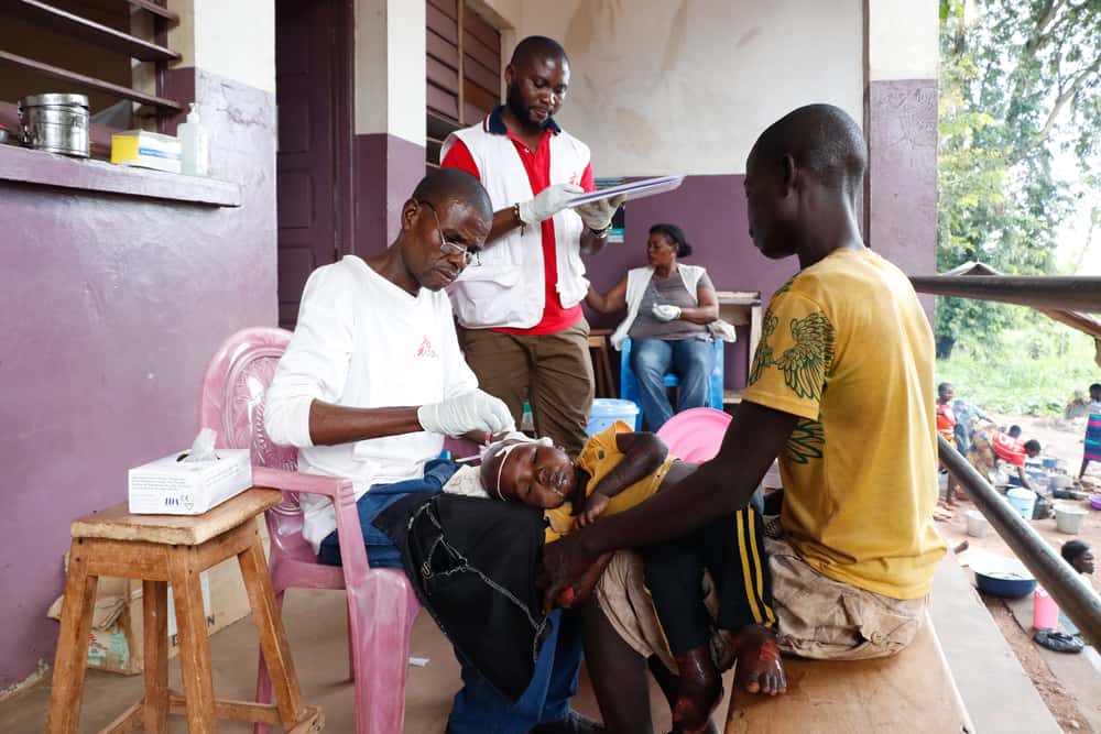 Parfait Doss&eacute;li, is the nurse supervisor at Bossangoa&rsquo;s hospital and he is working in the nutrition department. He is pictured here giving intravenous treatment to baby Fran&ccedil;ois, a child suffering from a form of malnutrition called kwashiorkor. Photo: Elisa Fourt/MSF