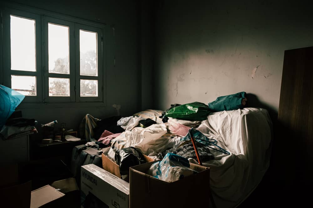 “The blast destroyed all the windows in the apartment, as well as my bed and some shelves. I’m now sleeping on the couch in my living room and I’m using the bedroom to store all the damaged furniture”, says Thérèse. Lebanon, December 2020. © KARINE PIERRE/HANS LUCASINSTAGRAM: @PICS_STONE