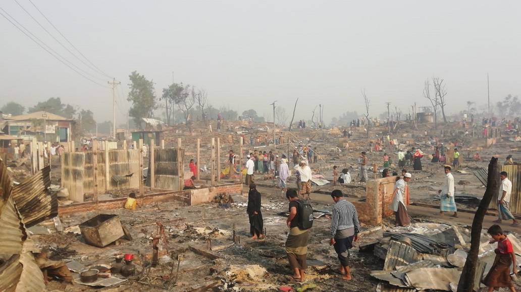 People are looking at their destroyed house / belongings in camp 9 area, one of the most affected by recent fire incident in Rohingya refugee camps.