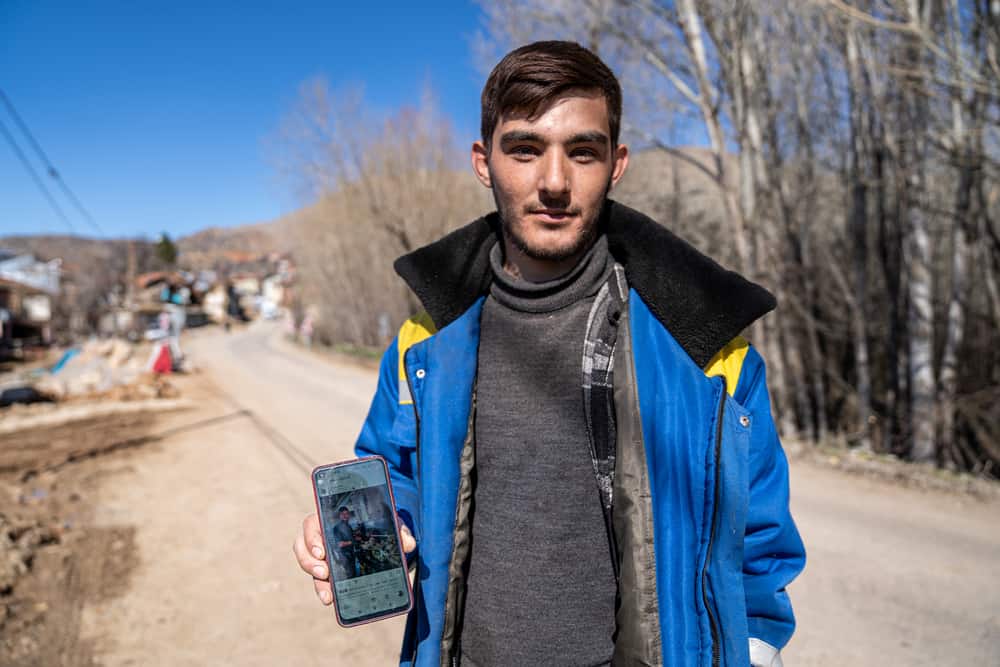 Yusuf Eren Ozkan, 22, is a student in Düzce Univeristy. He wants to be a chef. In this picture, he shows a photo of him cooking in a restaurant he works at part-time. “I came to visit my parents when I had a break from school. The night of the first earthquakes, I was playing video games in my room. At first, I thought it was going to stop shaking after a few seconds, but then I realised this was going to be bigger. After the first earthquake, me and my family still stayed in our house, and we turned on the TV and tried to find out what happened through the news. That’s when the second earthquake happened, and things got a bit tougher for us. We went outside and it was very cold, there was a lot of snow on the ground and falling from the sky. Then a rock fell and hit me and my father, and we were injured. We eventually set up a tent by ourselves for protection.  Now, me and my family are working in a communal restaurant, making and serving food for about 4,000 people. I’m here to help, I Iove Polat, but I feel hopeless about this village now. I have many dreams and I just want to live somewhere else. I want to pursue my dream of becoming a chef.”