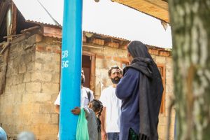 Doctors Without Borders India/Médecins Sans Frontières (MSF) community mental health workers speak with community members in a neighborhood of Tral, Kashmir. The team provides information about mental health conditions and explains the free counseling and support services available through MSF's mental health program in the region.